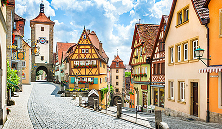 A cute Bavarian town with cobblestoned streets, traditional architecture on a sunny day