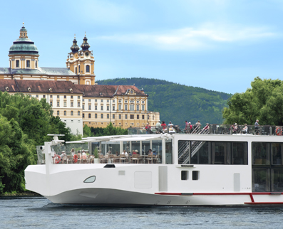 Viking River Cruise in the river with a big beautiful building in the background