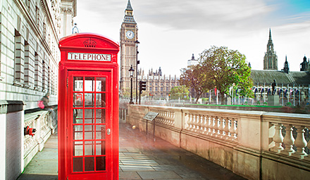 Quintessential red London telephone booth with the Big Ben clock tower in the background