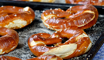 A baking sheet with freshly baked soft pretzels