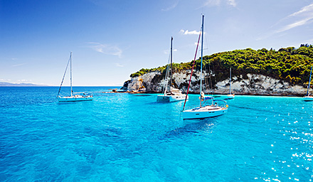 Sailboats anchored in the beautiful blue Mediterranean Sea