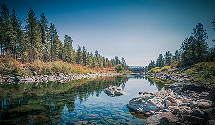 Rocky shores, water, lush landscaping in the Pacific Northwest
