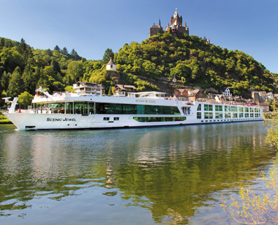 Scenic cruise ship in the river with a huge hill in the background with a castle on top