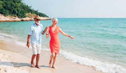 Beautiful couple walking a Caribbean beach